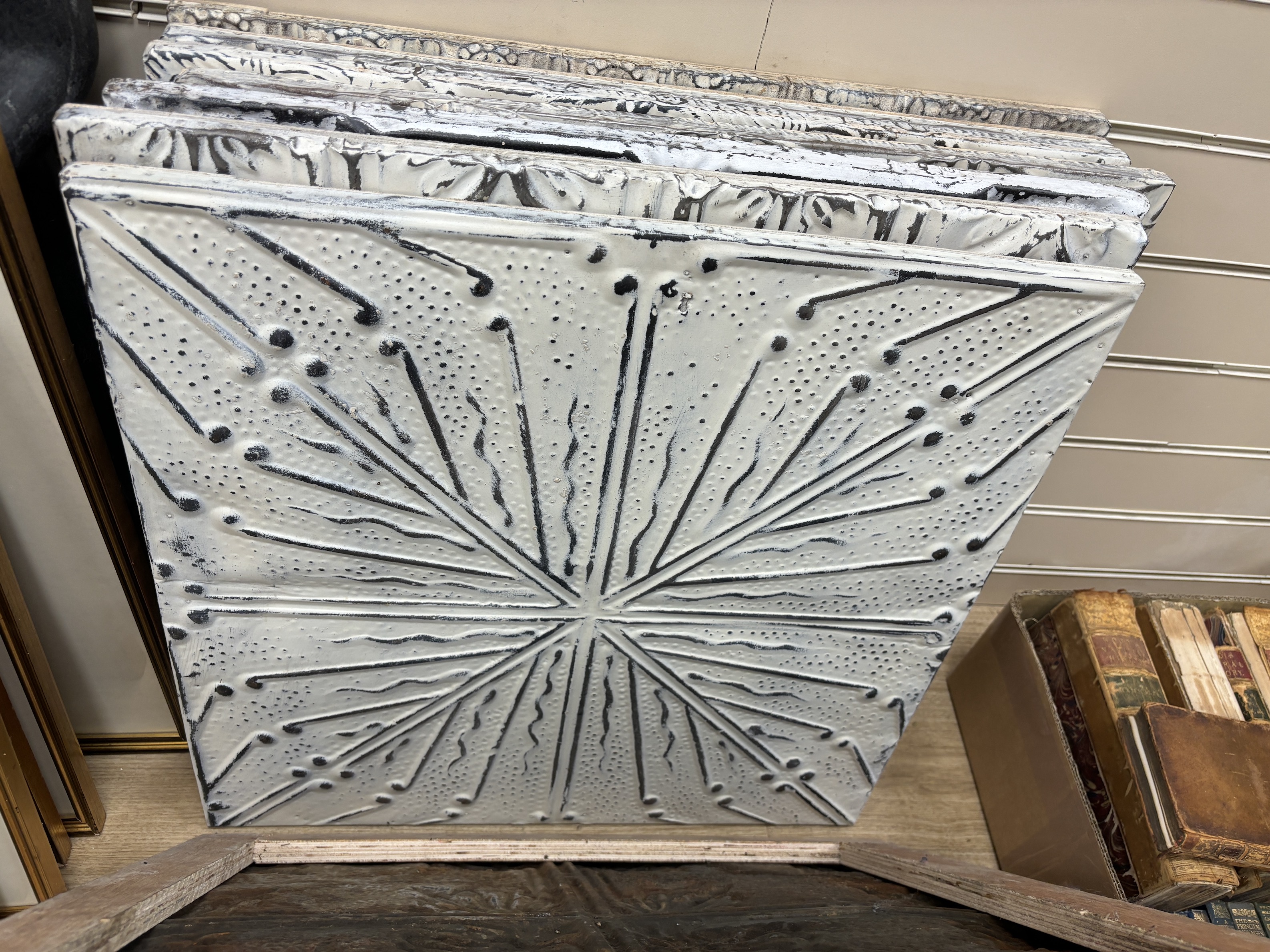 A group of nine decorative pressed tin panels made from salvaged antique tin ceilings, 59cm sq.